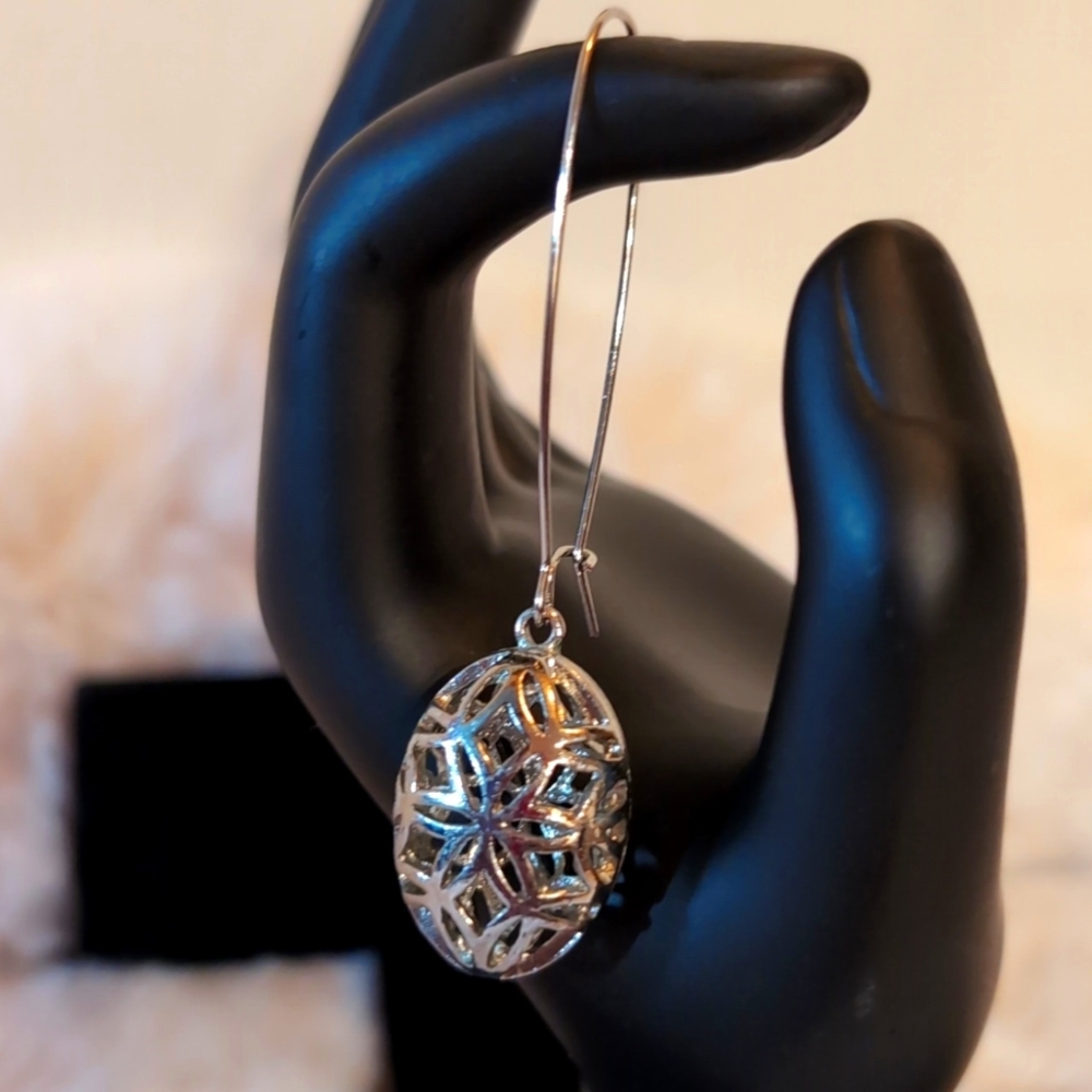 Silver Toned Long Drop Metal Earrings Oval With Snowflake Pattern